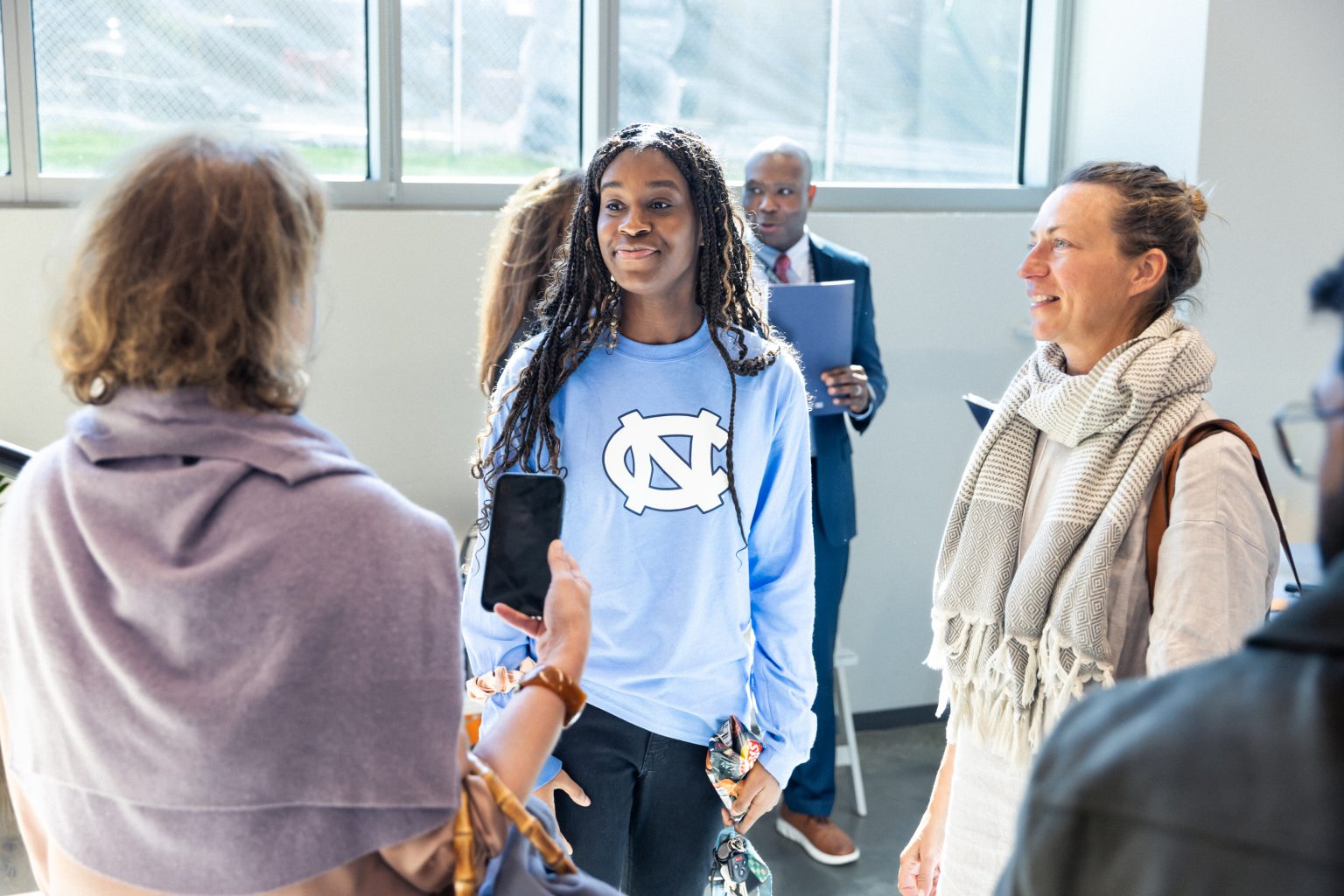 Student talking to professionals at the Junction